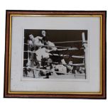 Leon Spinks signed black and white photo, Punch vs Muhammad Ali. Framed. Measures14 inch by 12-