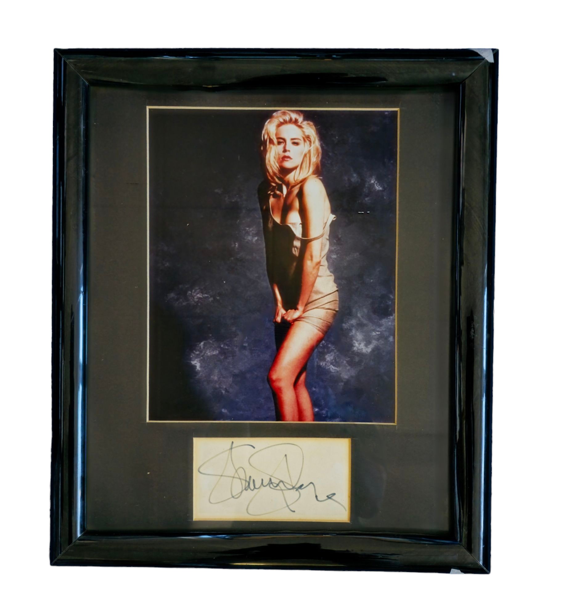 Sharon Stone signature piece with colour photo. Framed. Measures 13 inch by 15-inch appx. Good