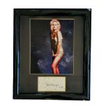 Sharon Stone signature piece with colour photo. Framed. Measures 13 inch by 15-inch appx. Good