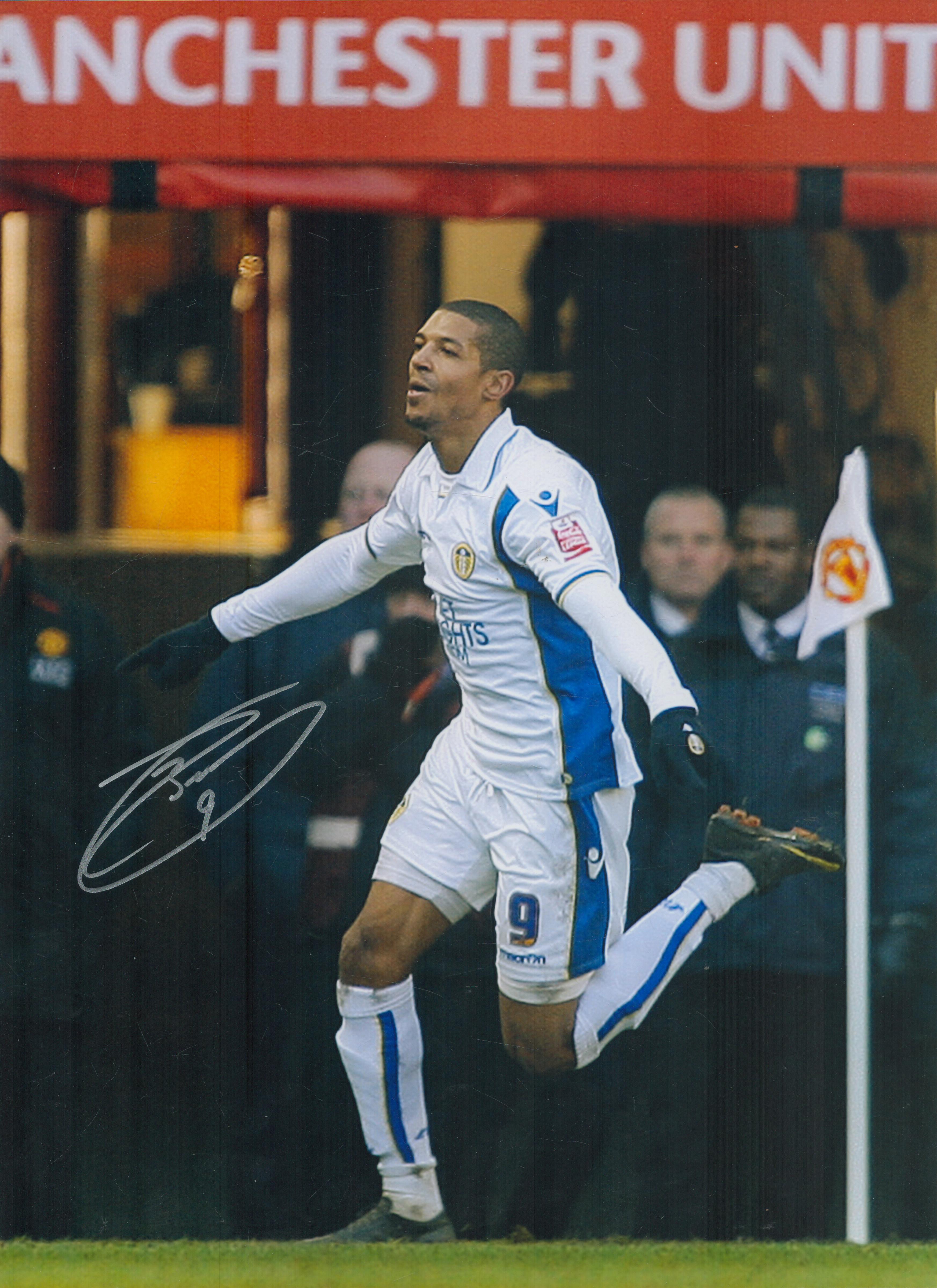 Autographed JERMAINE BECKFORD 16 x 12 Photo : Col, depicting Leeds United's JERMAINE BECKFORD