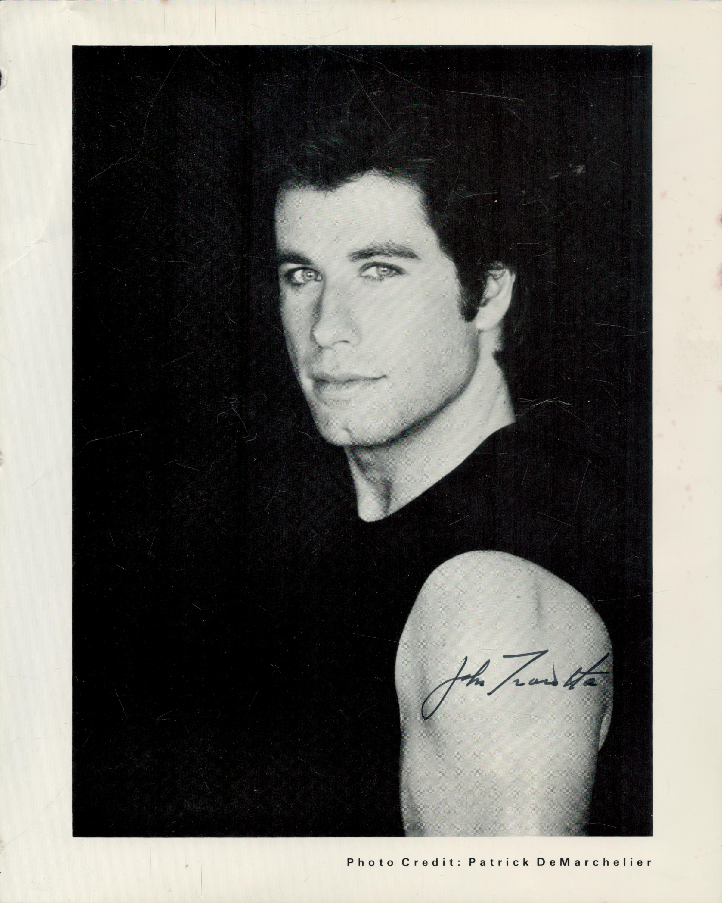 John Travolta signed 10x8 inch black and white photo. Good Condition. All autographs come with a