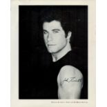 John Travolta signed 10x8 inch black and white photo. Good Condition. All autographs come with a
