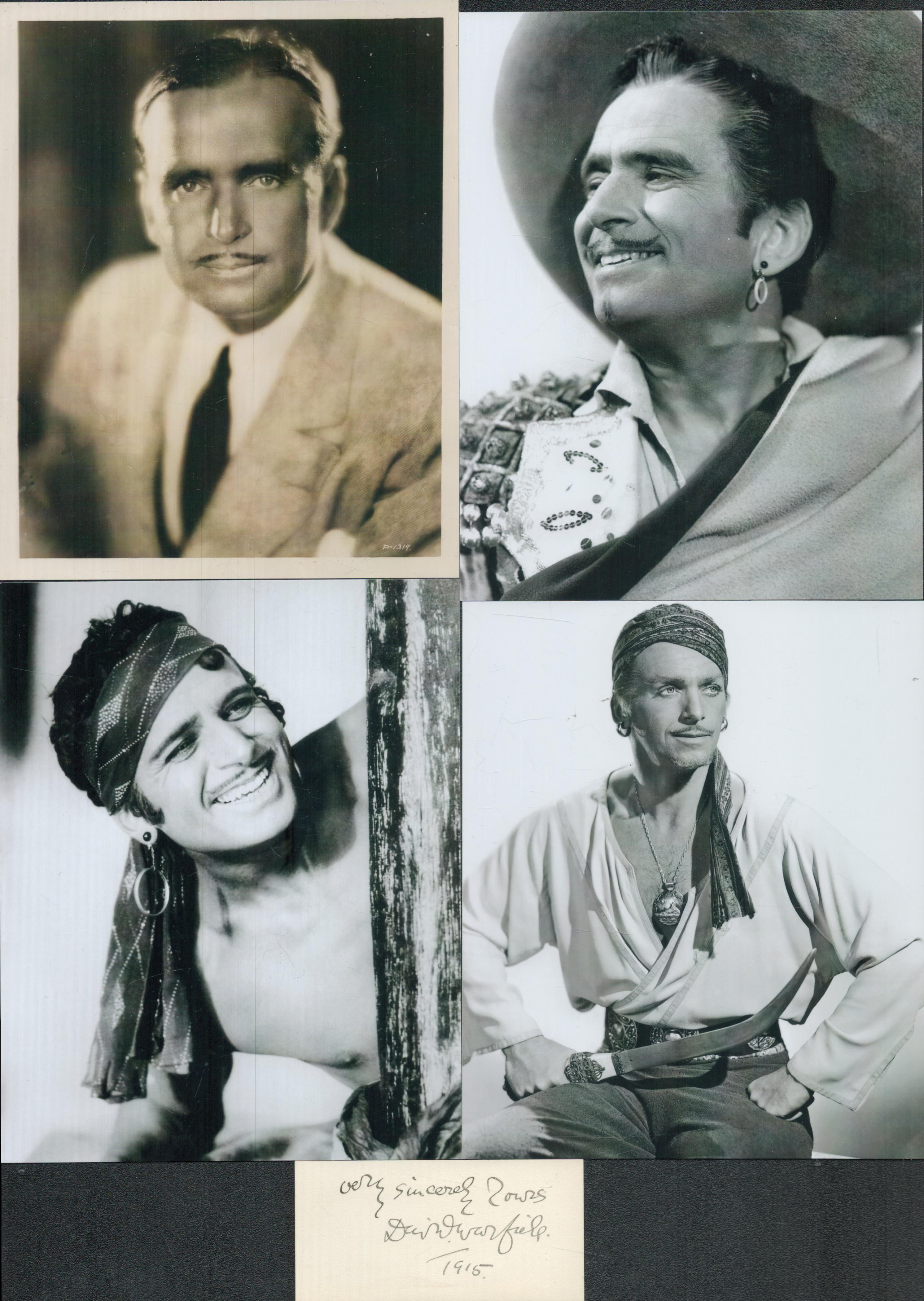 Douglas Fairbanks signed 3x1.5-inch card with four 5x6 inch unsigned black and white photos. Good