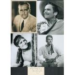 Douglas Fairbanks signed 3x1.5-inch card with four 5x6 inch unsigned black and white photos. Good