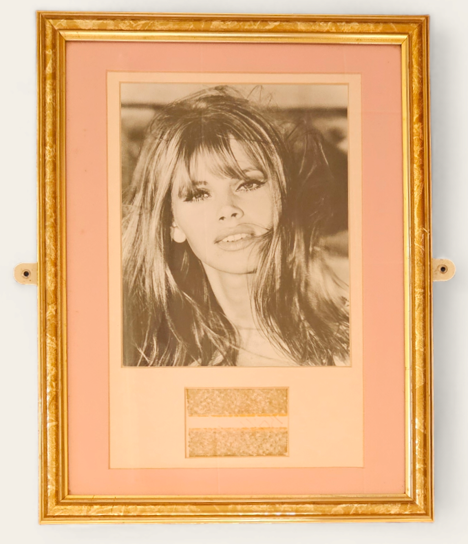 Britt Ekland signature piece with black and white photo. Framed. Measures 13 inch by 17-inch appx.