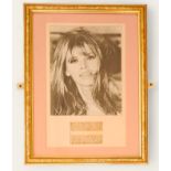 Britt Ekland signature piece with black and white photo. Framed. Measures 13 inch by 17-inch appx.