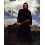 Johnny Cash signed 10x8 inch colour photo. Good Condition. All autographs come with a Certificate of
