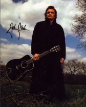 Johnny Cash signed 10x8 inch colour photo. Good Condition. All autographs come with a Certificate of