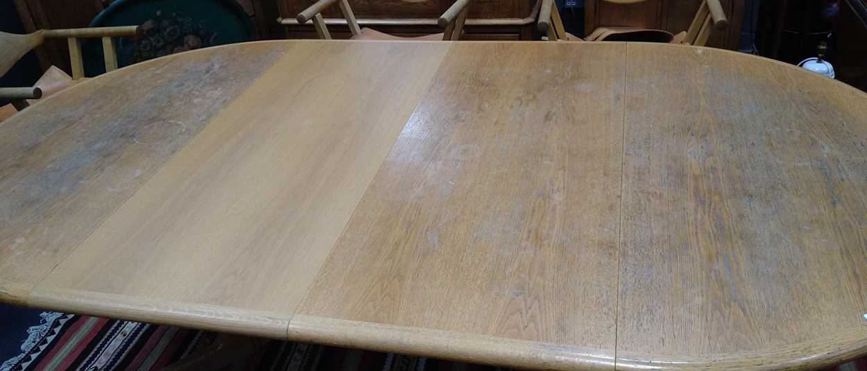 A 20th century blonde oak circular extending dining table with one additional leaf; together with - Image 14 of 16