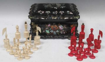 A Victorian papier mache box and Indian bone chessmen (some cracks)
