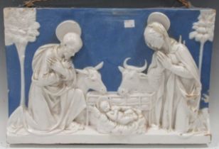 A continental pottery plaque of the Nativity, 32 x 50cm