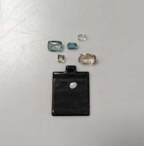 A collection of loose gemstones, to include, an aquamarine, a zircon, an opal, two colourless quartz