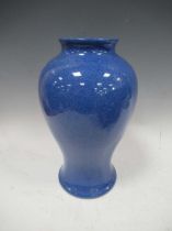 A Moorcroft powder blue vase, 32cm high there are a pair of small paralell scratches on the shoulder