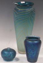 Group of three modern decorative blue glasswares, the largest with swirled gold decoration measuring