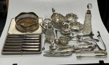 A collection of silver including pin trays, sauce boat, flatware, bottle coaster etc together with