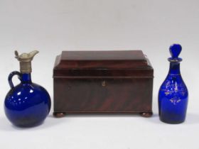 A 19th century mahogany tea caddy with three compartments, a blue glass brandy decanter with stopper