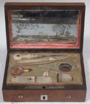 A 19th century small amboyna box fitted for sewing implements with various mother of pearl and