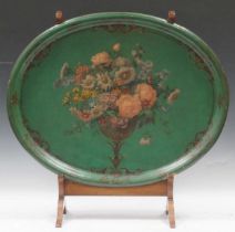 A Victorian green oval papier mache tray painted with a vase of flowers (a/f), tray ,measures 60 x