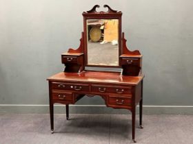 A late Victorian mahogany dressing table on square tapering legs and castors 176 x 124 x 60cm and