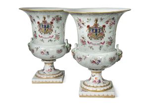 A pair of Sampson two-handled armorial urns,