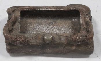 A rectangular Chinese soapstone dish with carved dragon decoration and six character mark to base,