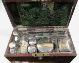 A 19th century mahogany and brass bound vanity travelling case, the hinged lid revealing a fitted