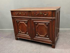 A 19th century Continental oak dresser base with two drawers over a pair of panelled doors, 97 x 135