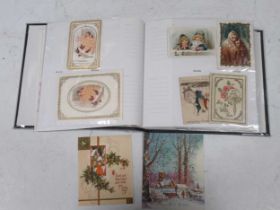 An album of old greeting cards, early 20th century, including World War I, etc