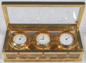 A Woodford weather station containing a quartz clock, thermometer and hygrometer, 15 x 7 x 4.5cm