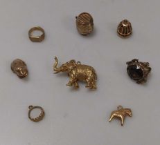 A hallmarked 9ct gold elephant charm together with seven other charms, gross weight 27.1g (8)