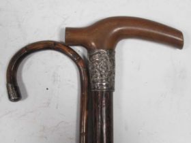 A silver mounted walking cane, a hardwood walking stick and a floral tapestry panel (3)