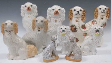 A collection of Staffordshire type spaniels, various dates