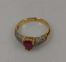 A glass filled ruby and diamond ring, tested as 18ct gold, weight 3g