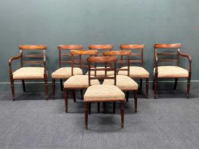 A set of eight Regency mahogany dining chairs, with stuff-over seats, to include two carvers (8)