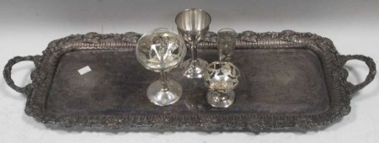 A silver plated rectangular tray, with foliate pattern surface and pierced fruiting vine border, two