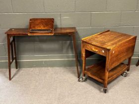 An oak bed table with adjustable reading stand and an oak trolley