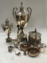 A collection of silver plated items including two urns, sauce boat, two coasters some flatware,