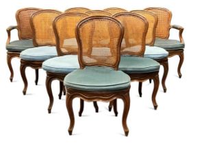 A set of ten Louis XV style walnut dining chairs, to include two carvers, the caned backs and