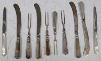 Four pairs of Georgian agate handled two tine forks and knives together with two silver bladed tea