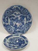 Two Chinese blue and white ceramic dishes, largest 34cm diameter (2) The porcelain plate has a rim