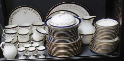 A Cauldon Ltd breakfast set with blue and gilt border and scrolling branch decoration, comprising