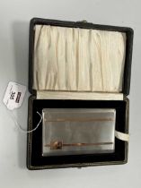 A cased silver pocket cigarette case with rose gold coloured decoration, 209.1g (6.7ozt)