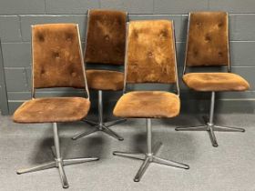 A set of four late 20th century button back and tubular chrome swivel action dining chairs by