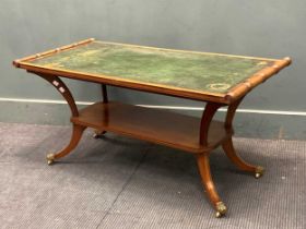 A leather top mahogany low table in the Regency style, on sabre legs 52 x 105 x 52cm