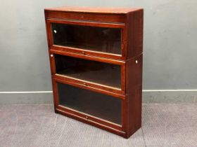 A three section oak stacking bookcase