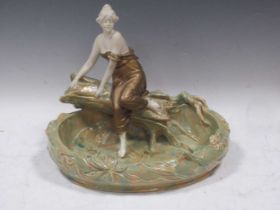 An Austrian/German Art Nouveau ceramic figure of a female bather by a pool, circa 1900, 28cm high