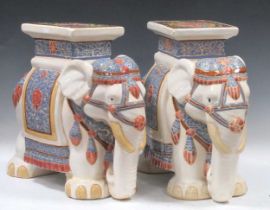 Pair of modern Chinese ceramic stools in the form of Elephants. The white bodies draped with