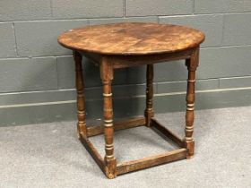 A circular yewwood top table with associated turned oak base 74cm