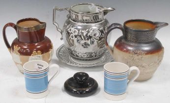 A collection of Victorian lustre ware, mainly jugs, three salt glazed stoneware jugs and a treen nut