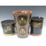 A floral painted waste paper bin, and two toleware bins, largest 40cm high (3)